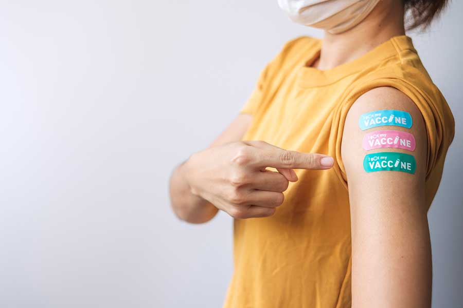 Woman's arm with bandaids